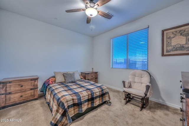 bedroom with light colored carpet and ceiling fan