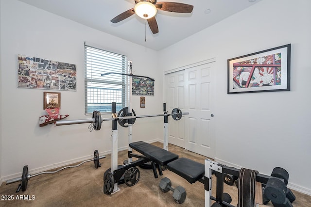 workout area with ceiling fan and carpet