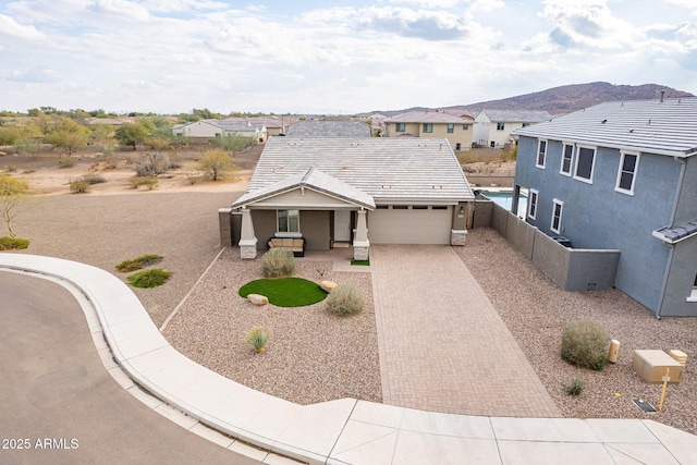 view of front of house with a mountain view and a garage