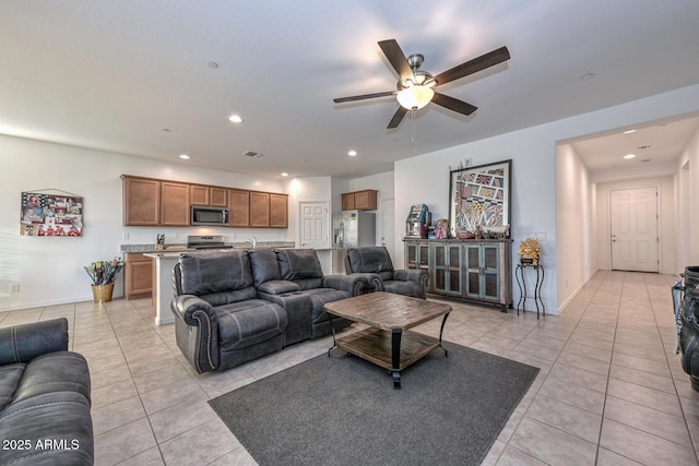 tiled living room with ceiling fan