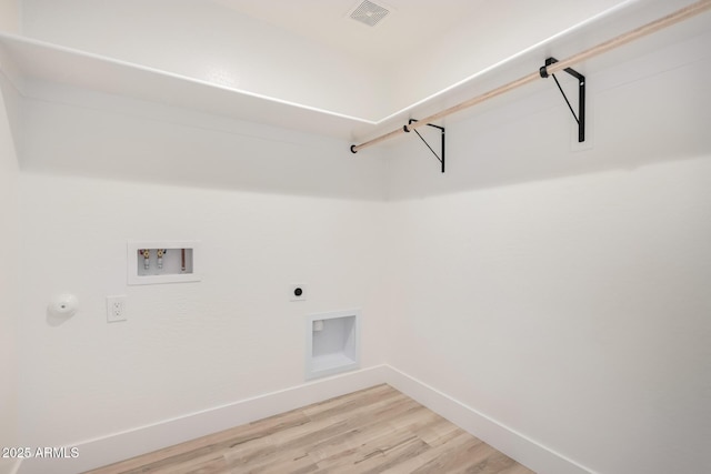 laundry room featuring hookup for a washing machine, laundry area, visible vents, baseboards, and light wood finished floors