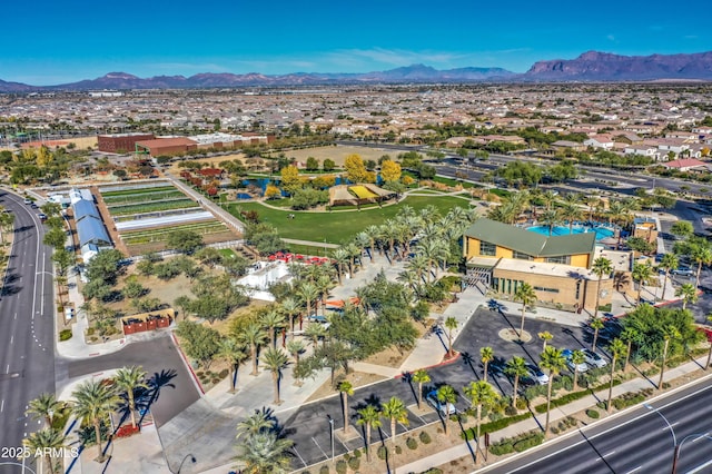 birds eye view of property featuring a mountain view