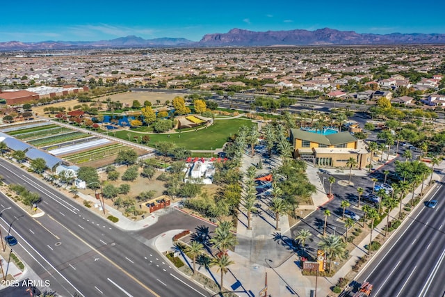 birds eye view of property with a mountain view