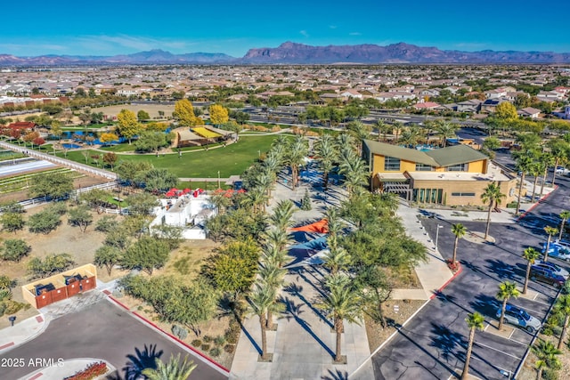 birds eye view of property with a mountain view