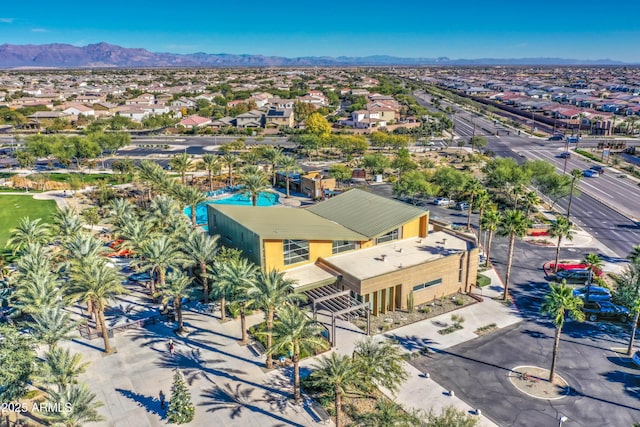 birds eye view of property with a mountain view