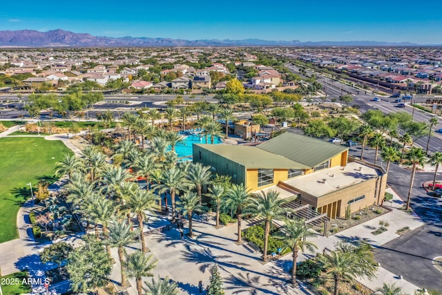 birds eye view of property with a mountain view