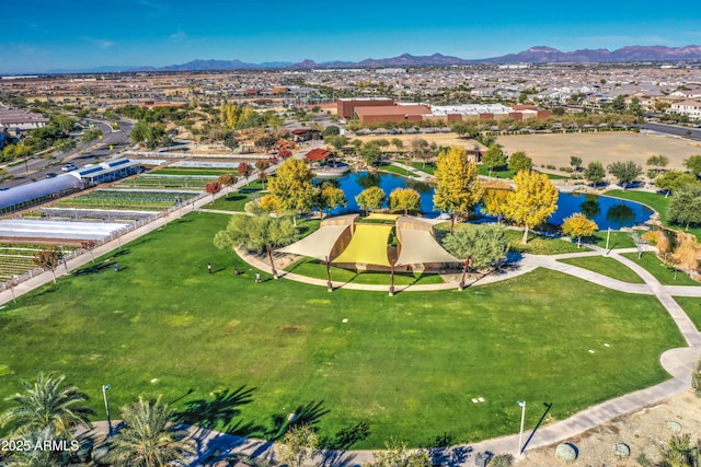 bird's eye view with a water and mountain view