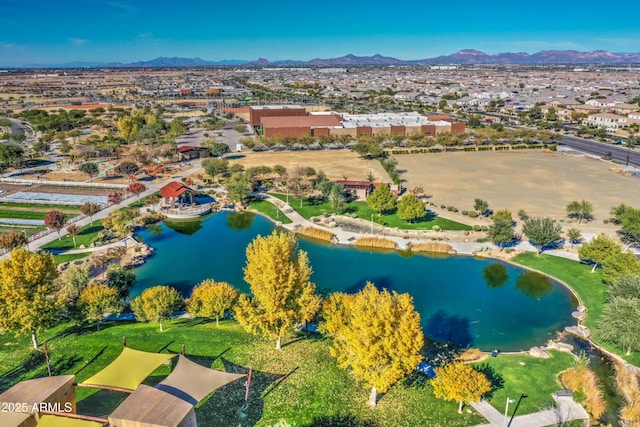 aerial view featuring a water and mountain view