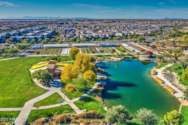 drone / aerial view with a water and mountain view