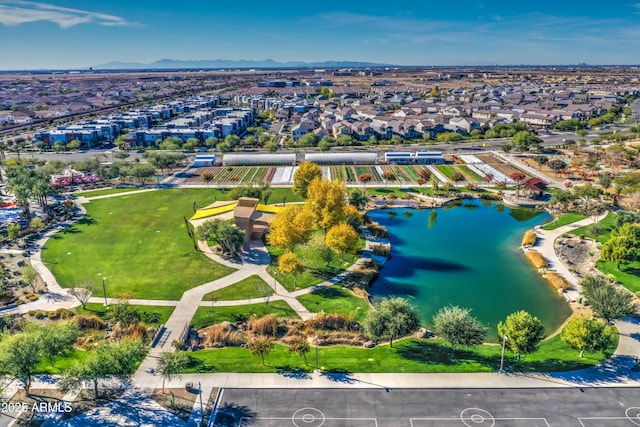 aerial view featuring a water and mountain view