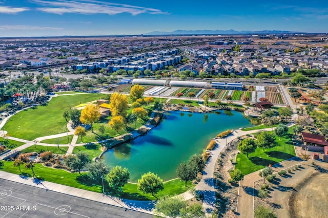 drone / aerial view with a water and mountain view