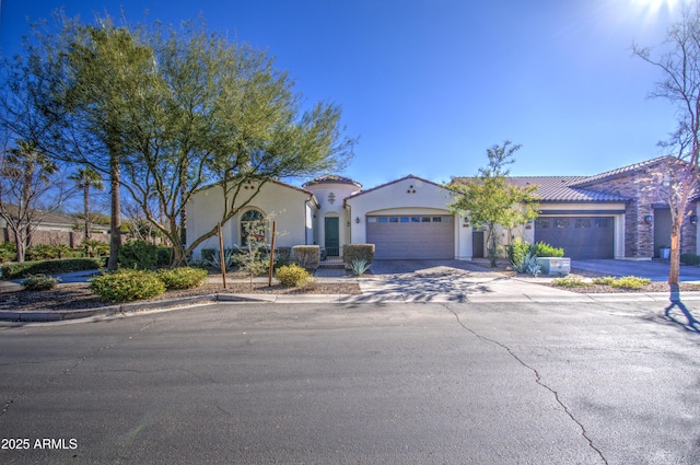 mediterranean / spanish-style home featuring a garage