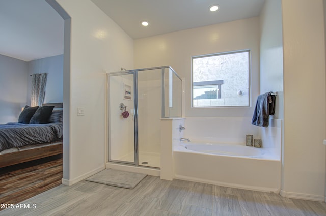 bathroom featuring plus walk in shower