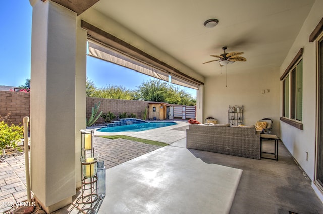 view of patio / terrace with ceiling fan, an outdoor hangout area, and a fenced in pool