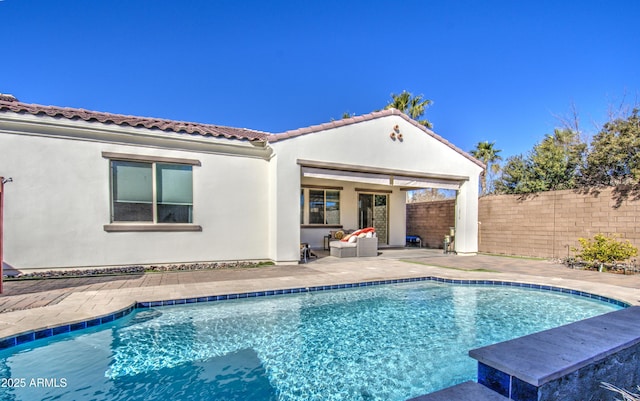 view of pool featuring a patio