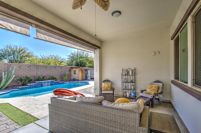 view of patio featuring ceiling fan and a fenced in pool