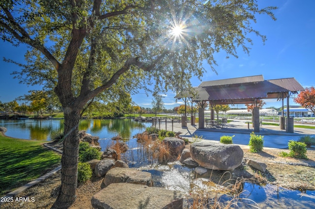 view of home's community with a gazebo and a water view