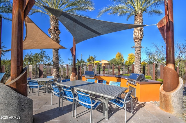 view of patio with an outdoor kitchen and area for grilling