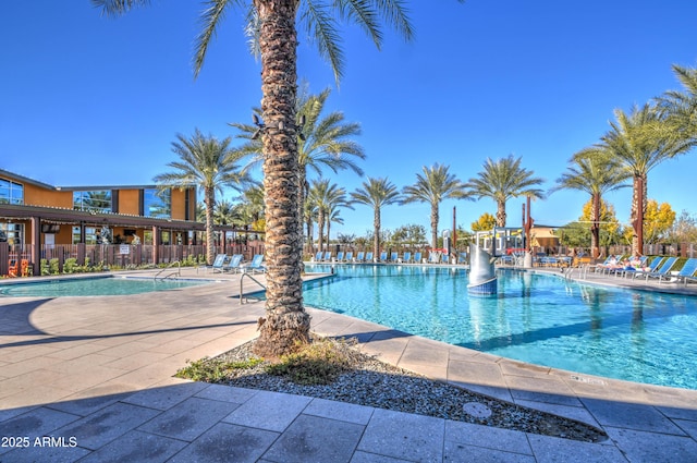 view of swimming pool with a patio area