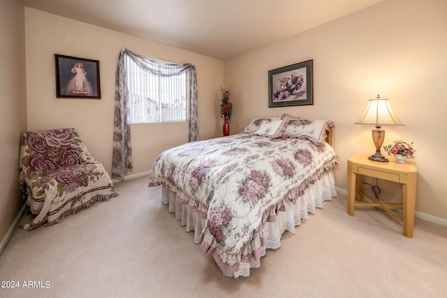 bedroom with light colored carpet