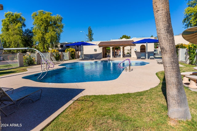 view of swimming pool featuring a patio area