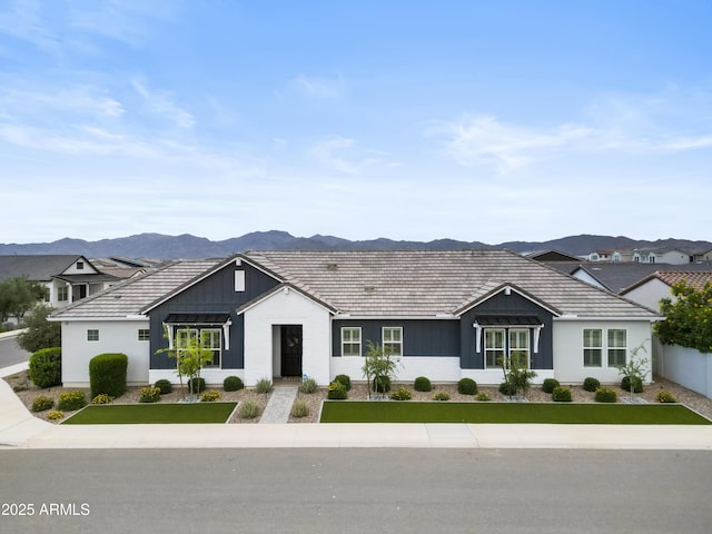 17146 W Mountainair St, Surprise, AZ 85388 - ranch-style home with a mountain view and board and batten siding