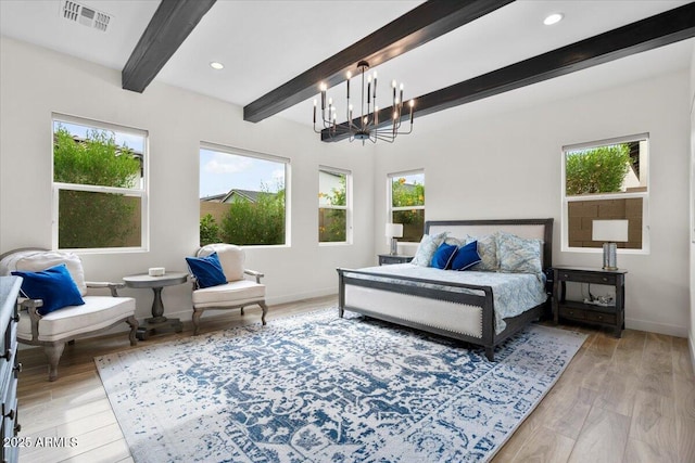 17146 W Mountainair St, Surprise, AZ 85388 - bedroom with beamed ceiling, multiple windows, baseboards, a chandelier, and light wood-style flooring