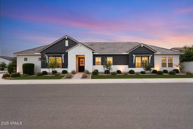 17146 W Mountainair St, Surprise, AZ 85388 - modern farmhouse with a tile roof