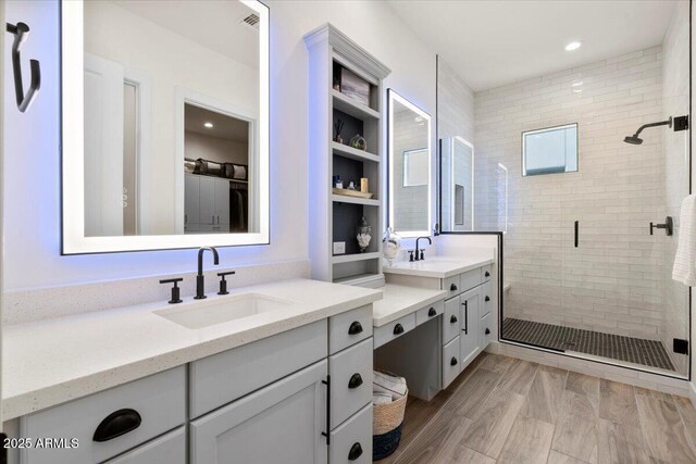 17146 W Mountainair St, Surprise, AZ 85388 - full bathroom with a stall shower, two vanities, and recessed lighting