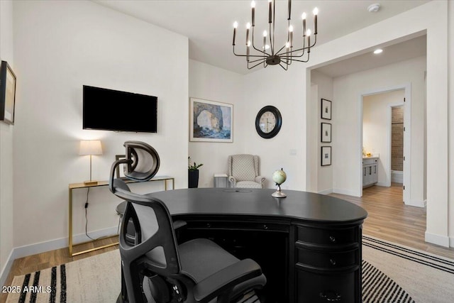 17146 W Mountainair St, Surprise, AZ 85388 - office featuring baseboards, wood finished floors, and a chandelier