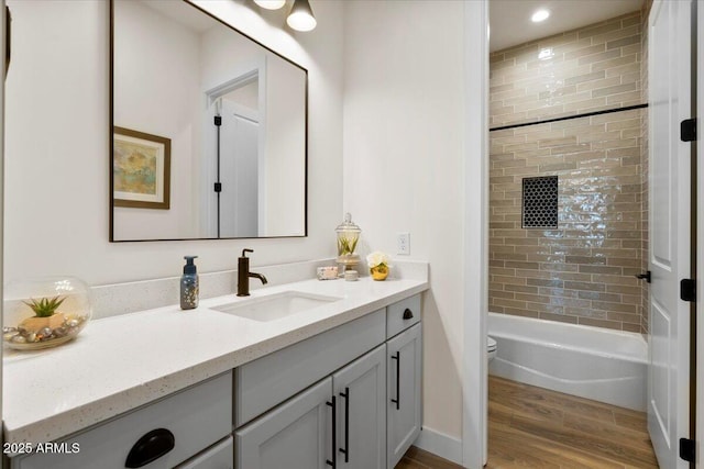 17146 W Mountainair St, Surprise, AZ 85388 - full bathroom with vanity, wood finished floors, toilet, and shower / tub combination