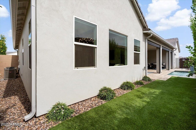 17146 W Mountainair St, Surprise, AZ 85388 - view of home's exterior featuring stucco siding, a patio area, and cooling unit