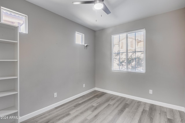 unfurnished room featuring light hardwood / wood-style floors and ceiling fan