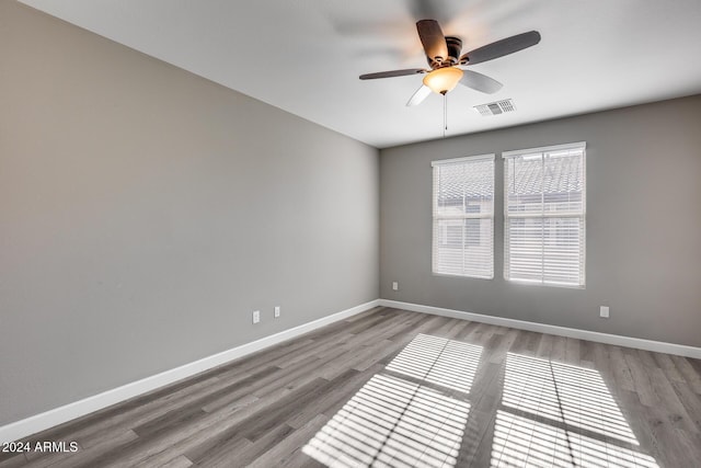 unfurnished room featuring ceiling fan and light hardwood / wood-style flooring