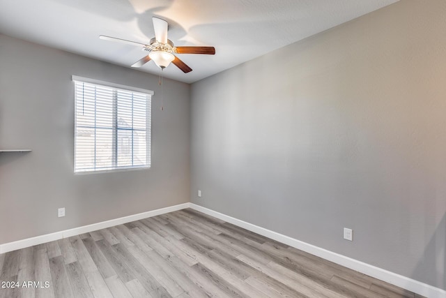 unfurnished room with light wood-type flooring and ceiling fan