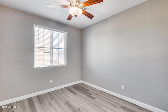 empty room featuring ceiling fan and light hardwood / wood-style flooring