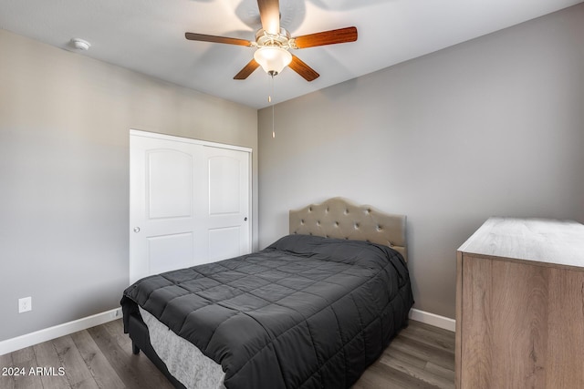 bedroom featuring ceiling fan and wood-type flooring