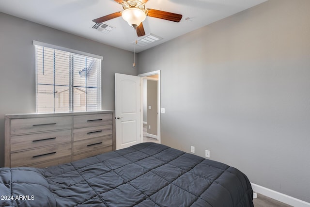 unfurnished bedroom featuring ceiling fan and hardwood / wood-style floors