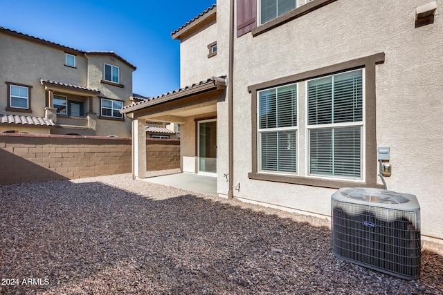 back of house featuring a patio area and cooling unit