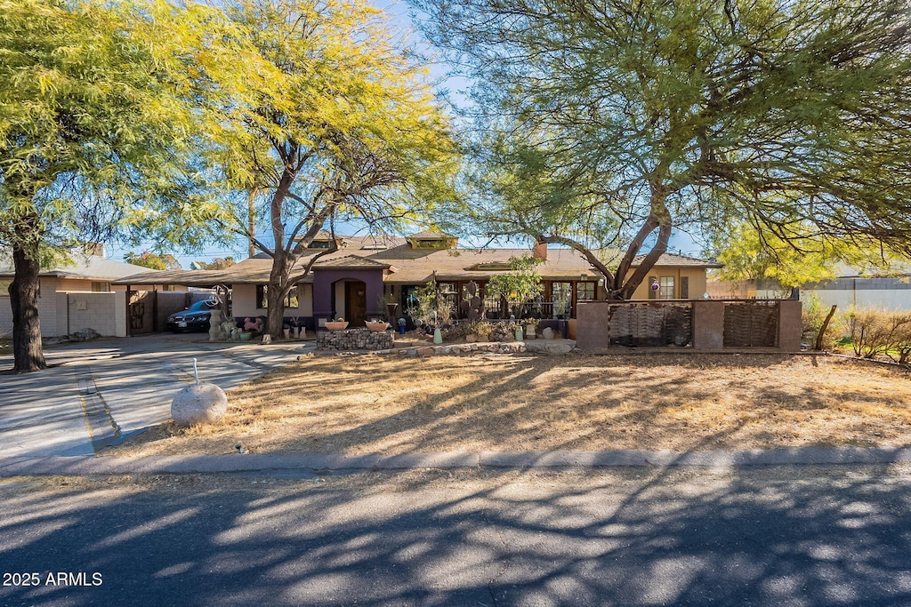 ranch-style house with a carport