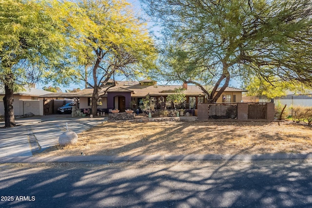 ranch-style house with a carport