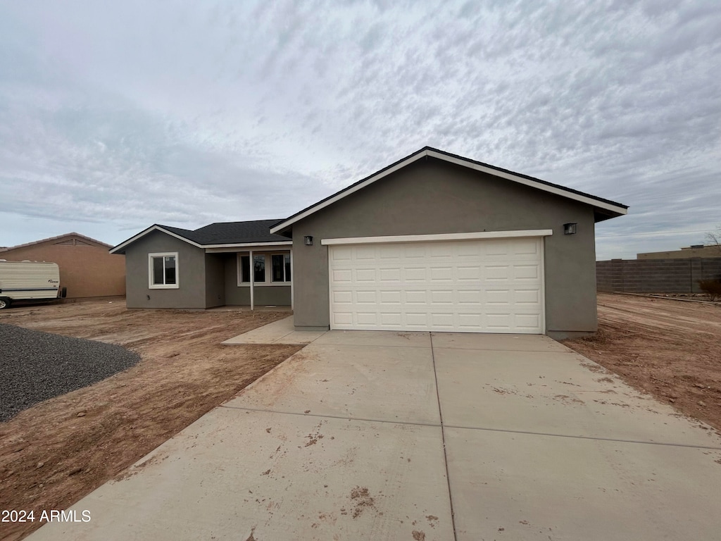 single story home featuring a garage