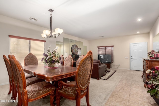 dining space featuring a notable chandelier, light tile patterned floors, recessed lighting, visible vents, and baseboards