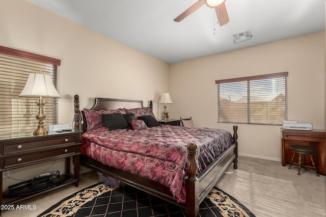 bedroom featuring a ceiling fan, baseboards, visible vents, and carpet flooring