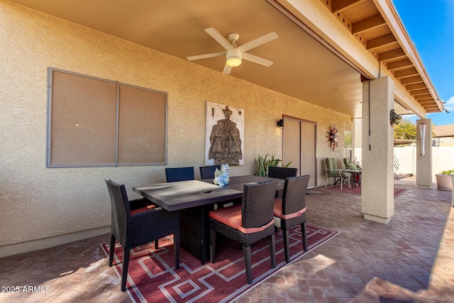 view of patio / terrace featuring ceiling fan and outdoor dining space