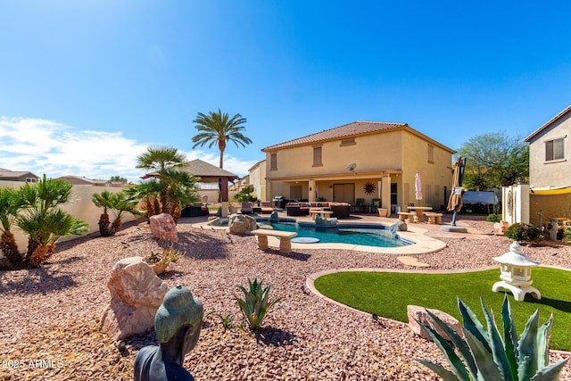 view of pool with a fenced in pool, a patio area, a fenced backyard, and an outdoor living space