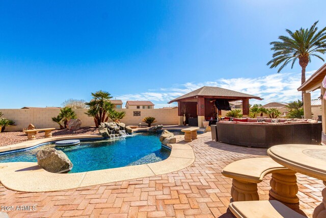 view of swimming pool with a patio, a fenced backyard, a gazebo, a fenced in pool, and a hot tub