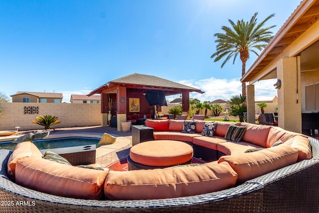 view of patio featuring a fenced backyard, a gazebo, and an outdoor hangout area