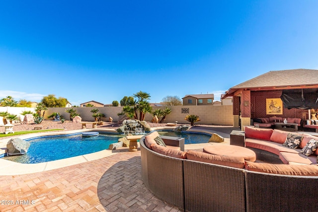 view of pool with a fenced in pool, a patio, outdoor lounge area, a hot tub, and a fenced backyard