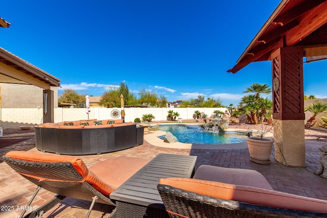 view of swimming pool featuring a fenced in pool, a fenced backyard, a patio, and an outdoor living space